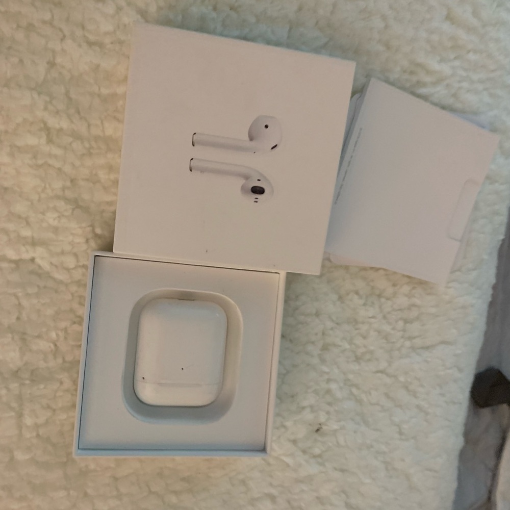 Apple AirPods with wireless charging case. Brand new!!